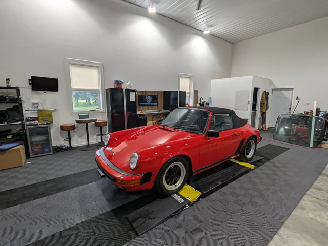 Red 1988 Porsche 911 at the GT Collective studio